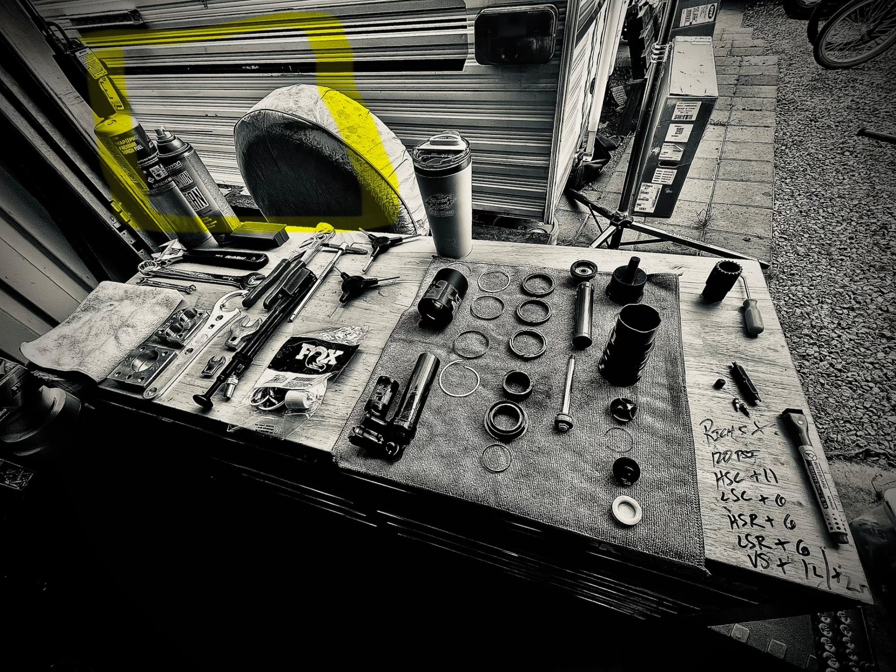 Multiple bicycle shocks on a workbench